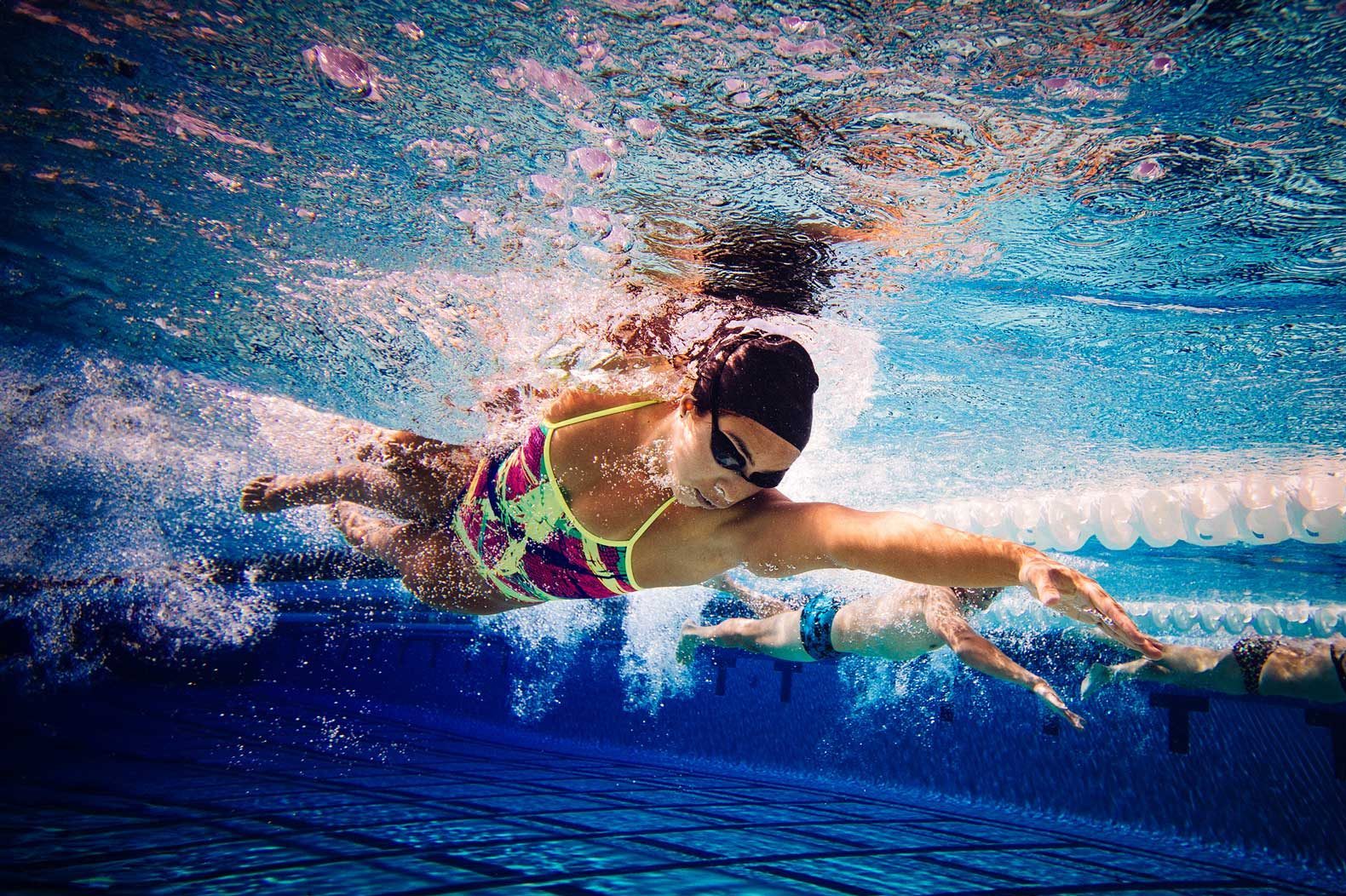 Swimming earplugs and earmolds designed to keep water out and protect ears during swimming and water activities Swimming earplugs and earmolds designed to keep water out and protect ears during swimming and water activities